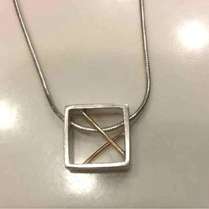 Contemporary custom setting. Sterling silver and 14k gold necklace